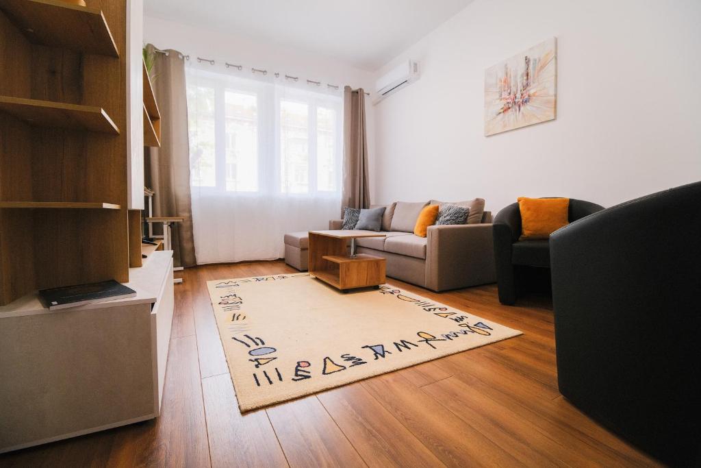 a living room with a couch and a rug at Apartment in the city center in Plovdiv