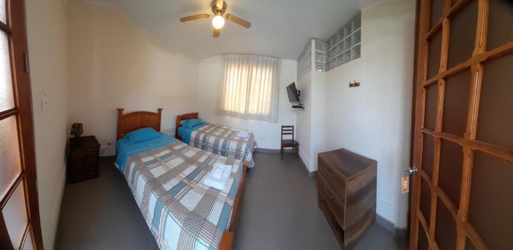 Postel nebo postele na pokoji v ubytování Centro Campestre Qawisqa