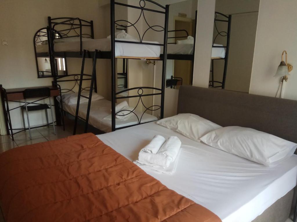 Postel nebo postele na pokoji v ubytování Delfini Hotel