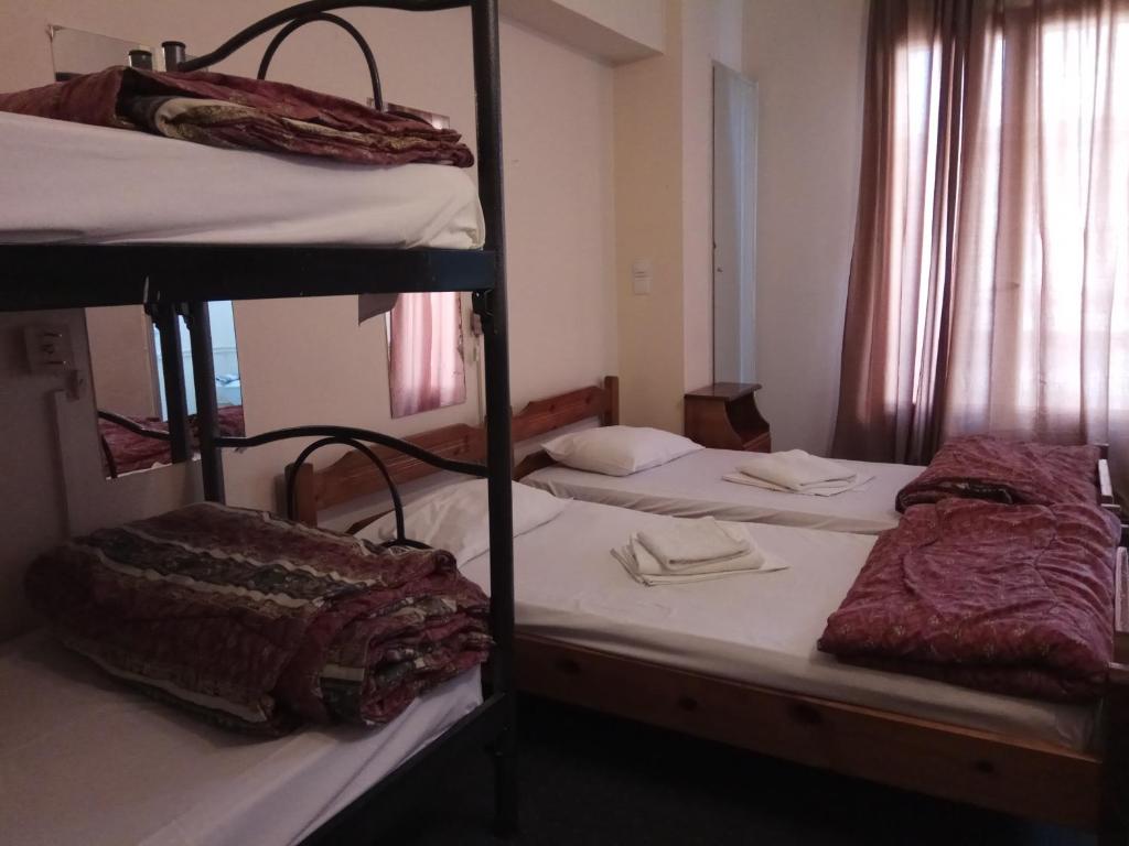 Postel nebo postele na pokoji v ubytování Delfini Hotel