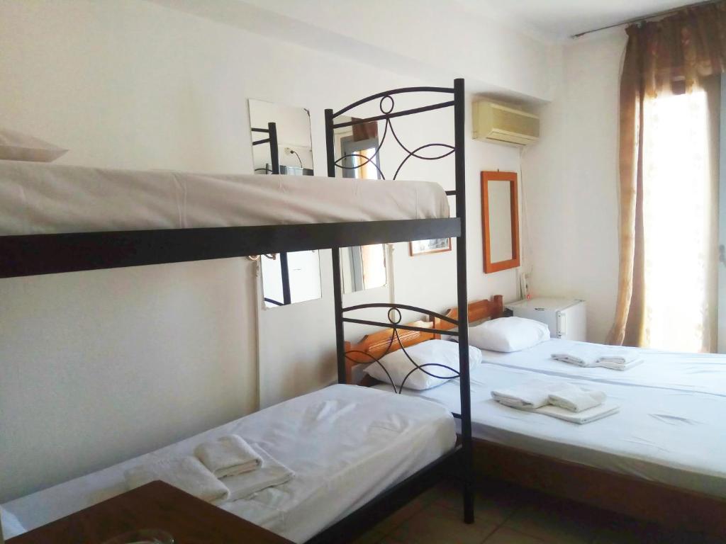 Postel nebo postele na pokoji v ubytování Delfini Hotel
