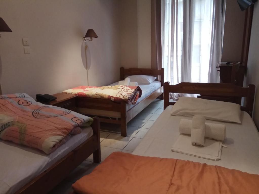 Postel nebo postele na pokoji v ubytování Delfini Hotel