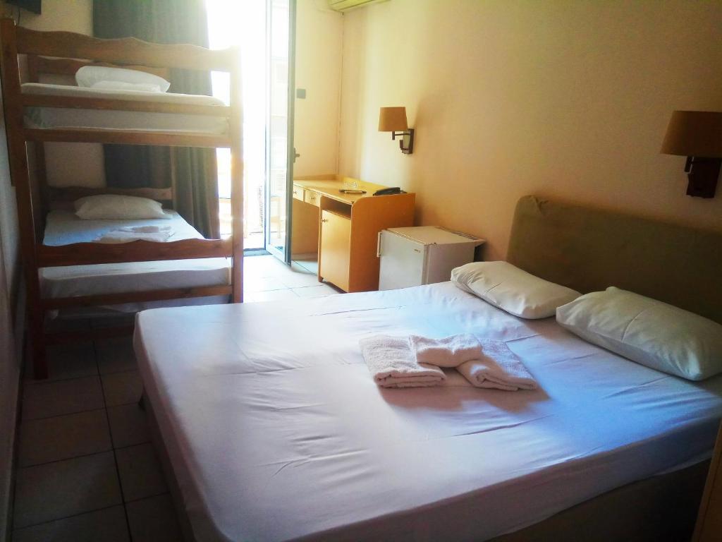 Postel nebo postele na pokoji v ubytování Delfini Hotel