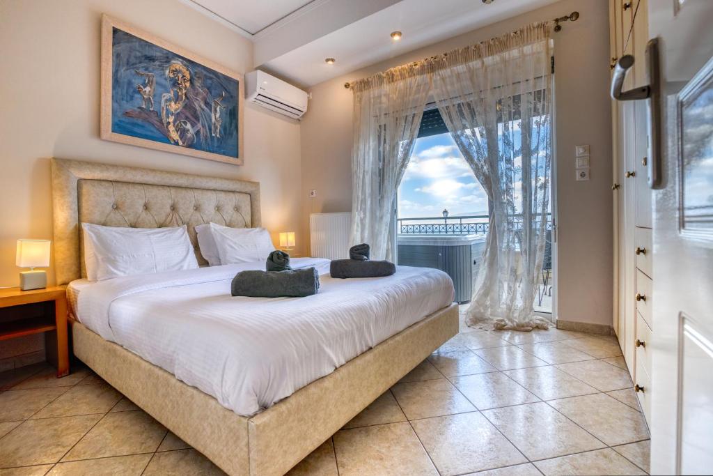Postel nebo postele na pokoji v ubytování Votsalakia Hotel & Luxury Apartments