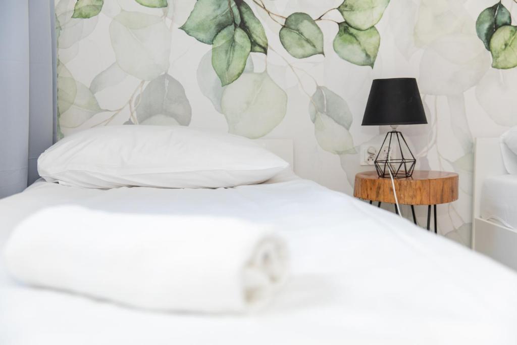 Posteľ alebo postele v izbe v ubytovaní Apartamenty Przylesie