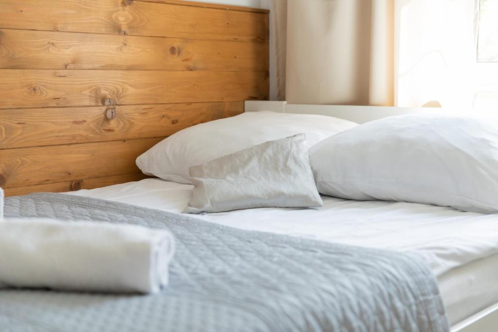 Posteľ alebo postele v izbe v ubytovaní Apartamenty Przylesie