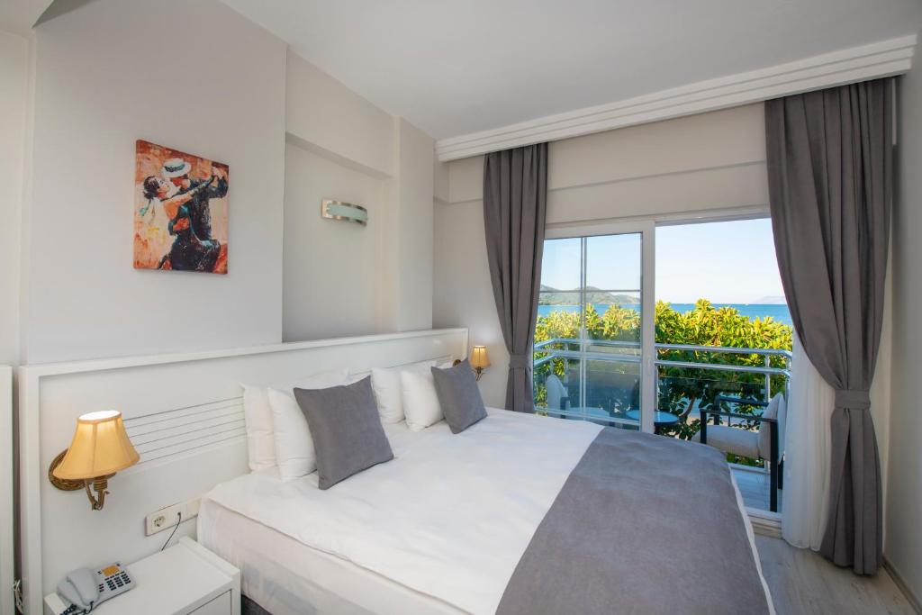 Postel nebo postele na pokoji v ubytování Mia Casa Hotel