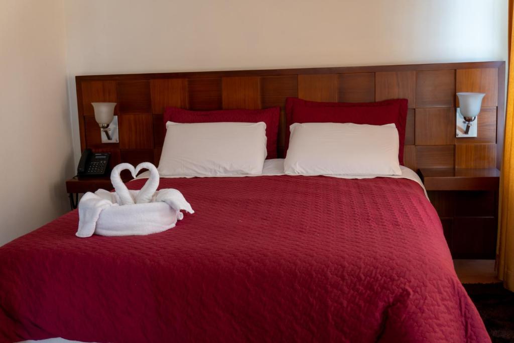 Postel nebo postele na pokoji v ubytování Chaupimundo Lodge