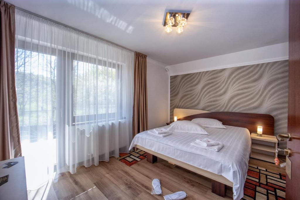 Postel nebo postele na pokoji v ubytování Amedeia