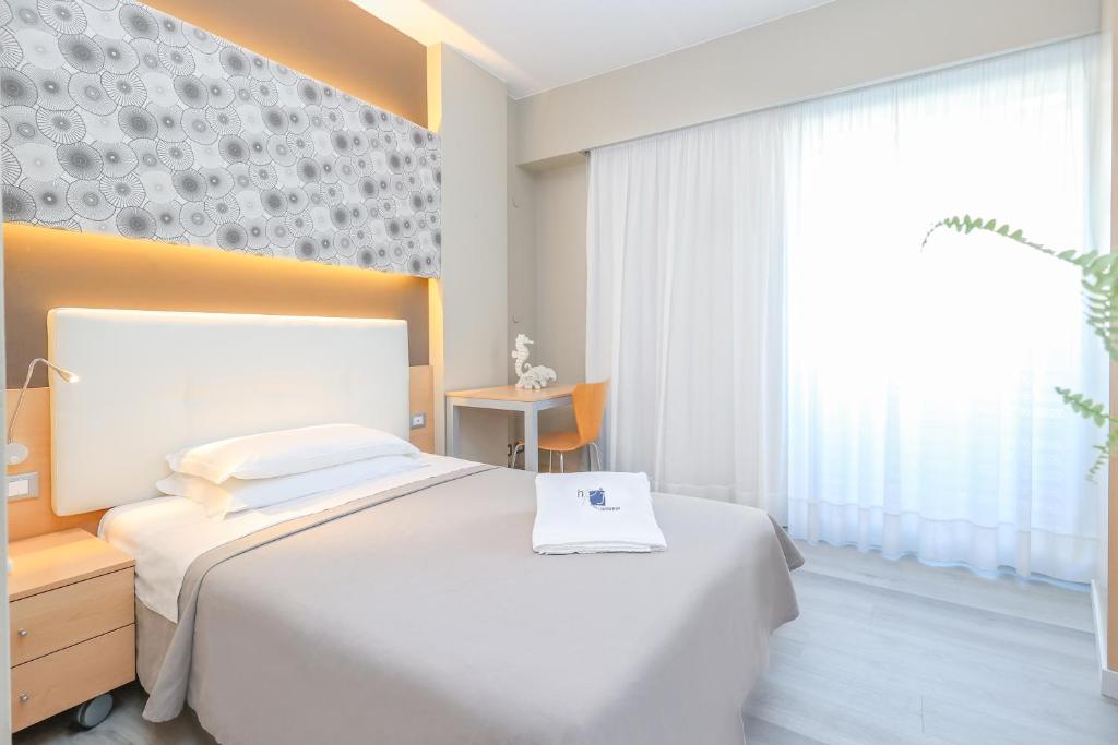 Postel nebo postele na pokoji v ubytování Hotel Rosanna 3 Stelle Superior