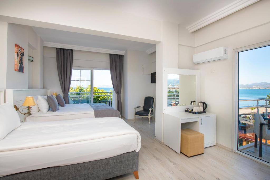 Postel nebo postele na pokoji v ubytování Mia Casa Hotel