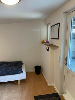 Postel nebo postele na pokoji v ubytování Rundvejen Guest House