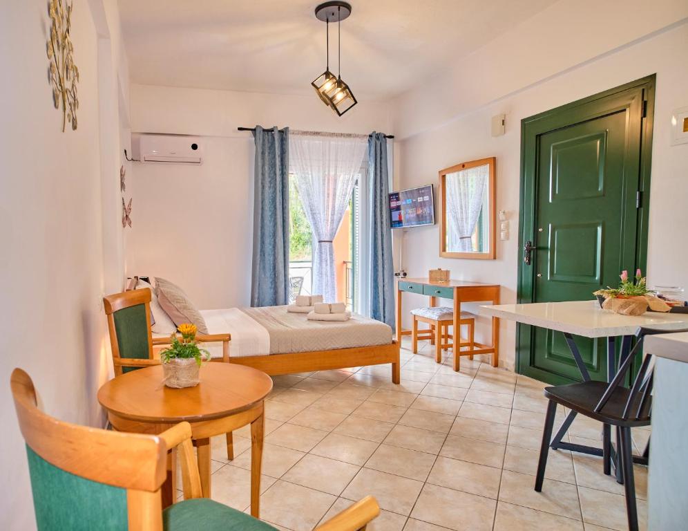 a living room with a couch and a table at Logas Beach Studios Peroulades Corfu in Peroulades