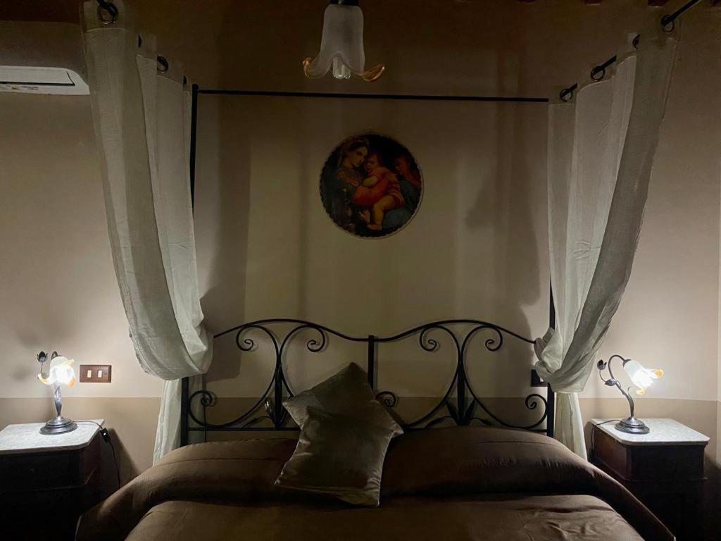 Postel nebo postele na pokoji v ubytování Locazione turistica ex Le Casette Di Cedromonte