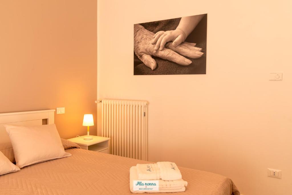 Postel nebo postele na pokoji v ubytování Alla nonna