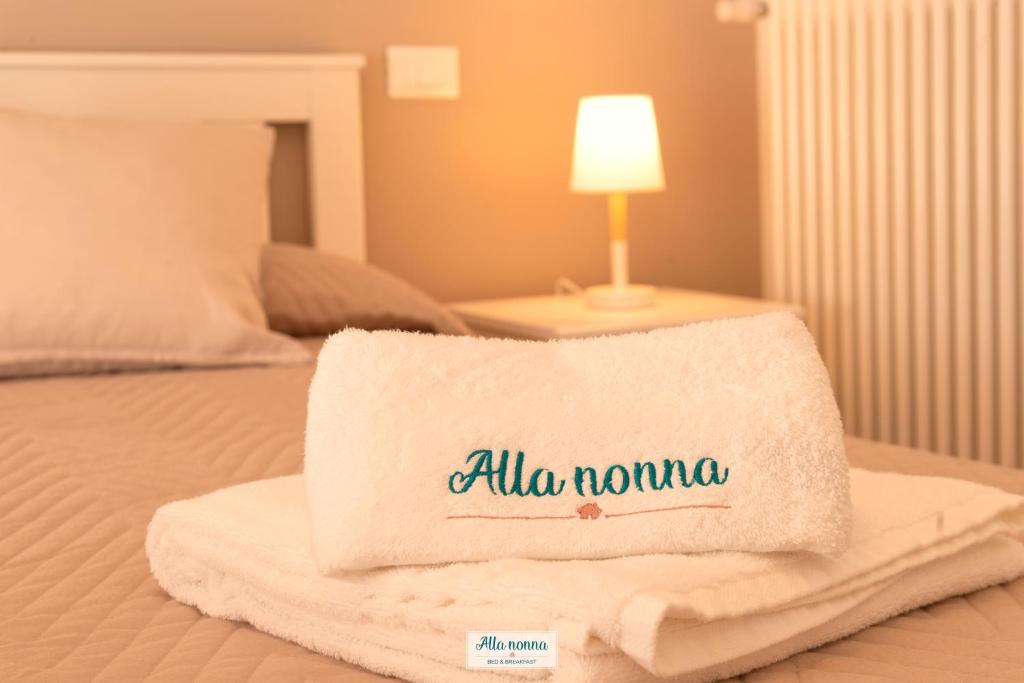 Postel nebo postele na pokoji v ubytování Alla nonna
