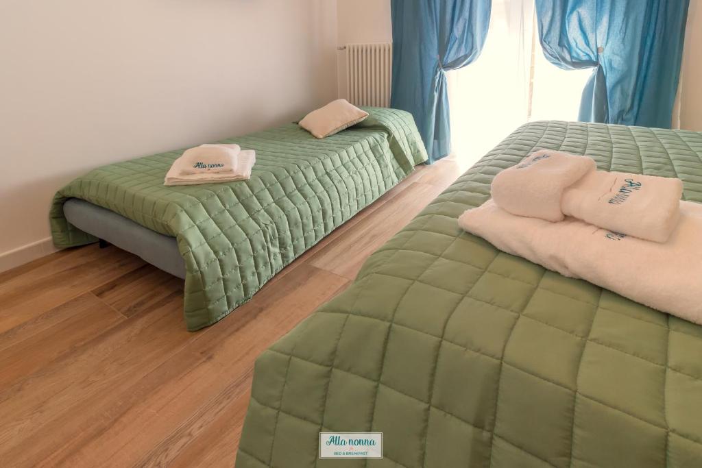 Postel nebo postele na pokoji v ubytování Alla nonna