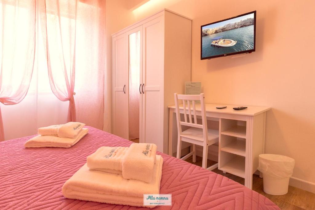 Postel nebo postele na pokoji v ubytování Alla nonna