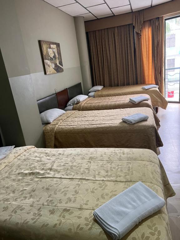 Postel nebo postele na pokoji v ubytování Hotel Rizzo
