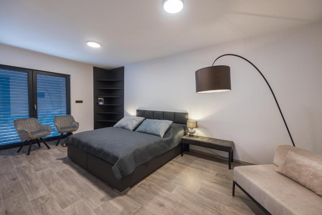 Postel nebo postele na pokoji v ubytování Apartmány Na Lánech