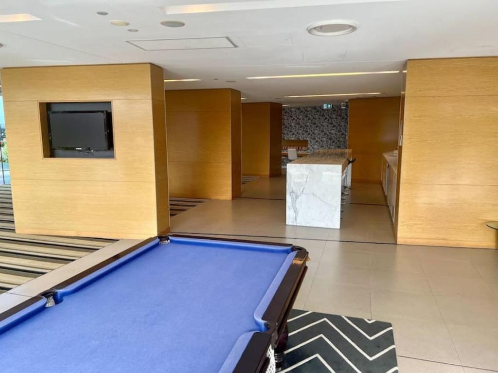 a lobby with a pool table and a tv at Oracle 11th floor Tower 1 - GC Getaways in Gold Coast