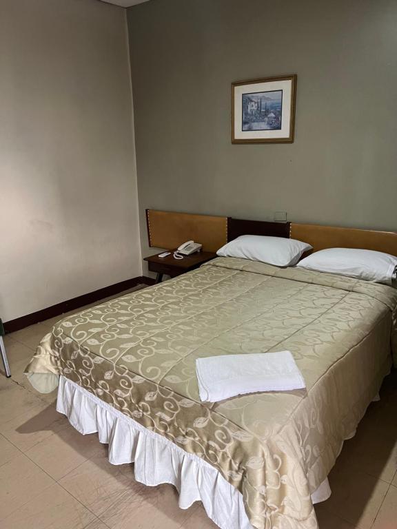 Postel nebo postele na pokoji v ubytování Hotel Rizzo