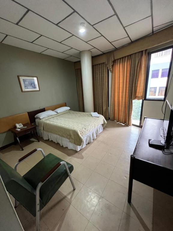 Postel nebo postele na pokoji v ubytování Hotel Rizzo