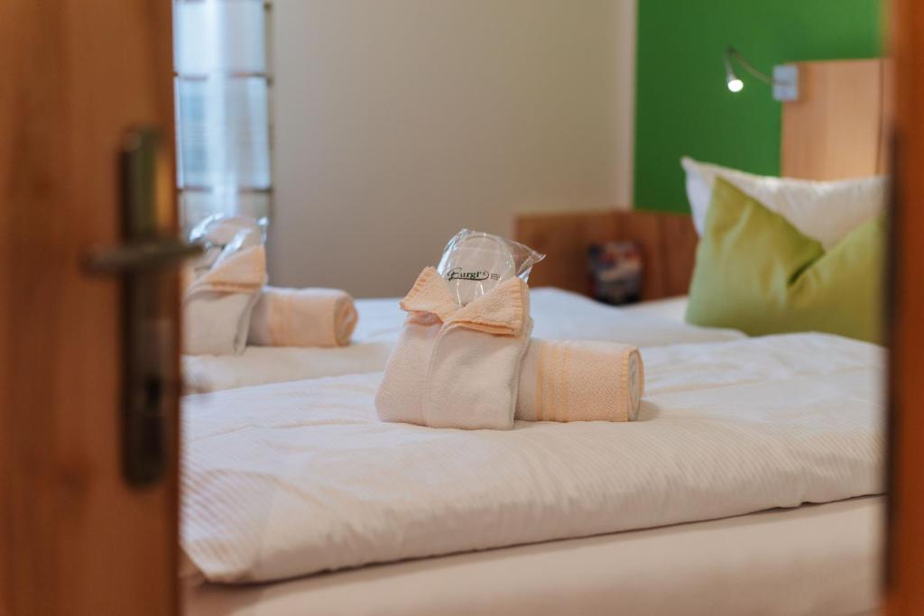 Postel nebo postele na pokoji v ubytování Burgls Apartmenthaus