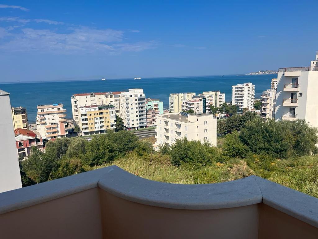 a view of the ocean from a balcony of a city at Villa Dei Limoni in Durrës