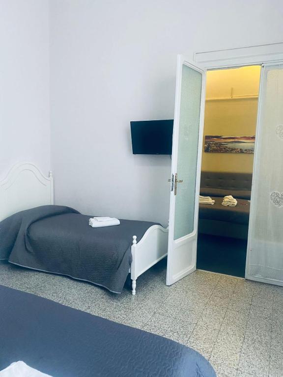 Posteľ alebo postele v izbe v ubytovaní Nel cuore Di Napoli