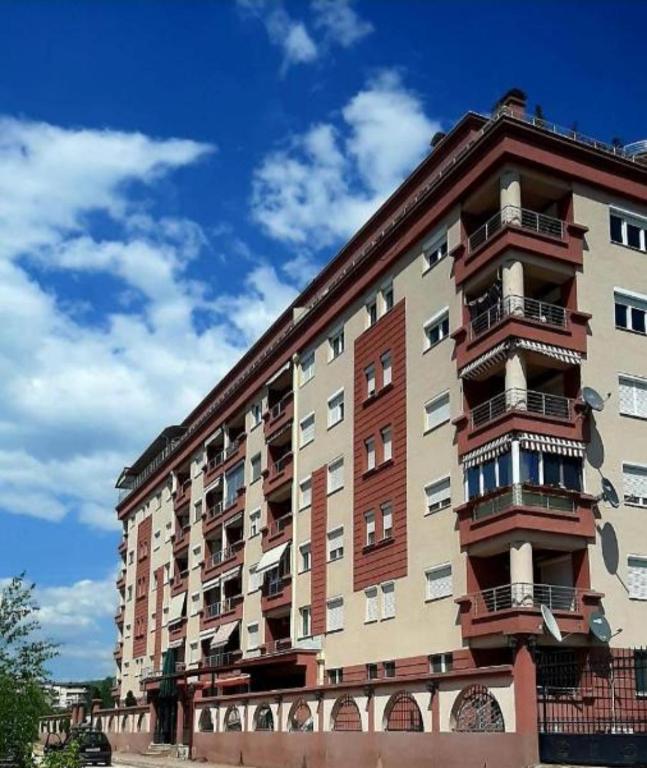 a tall building with balconies on the side of it at Sunny Place in Ohrid