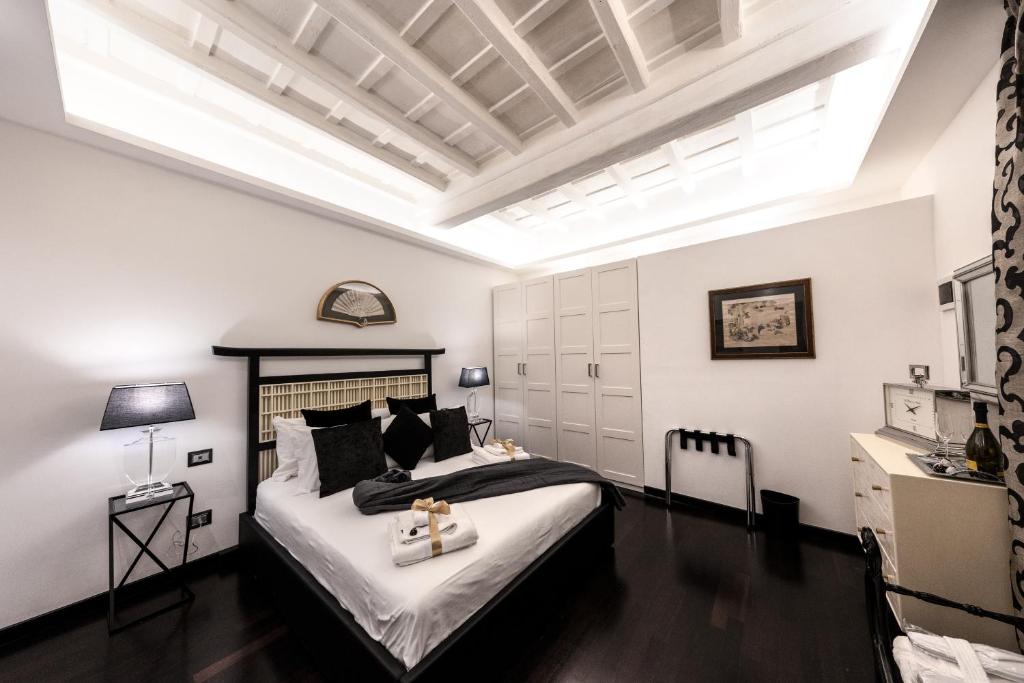 Barcaccia Luxury Suites 객실 침대