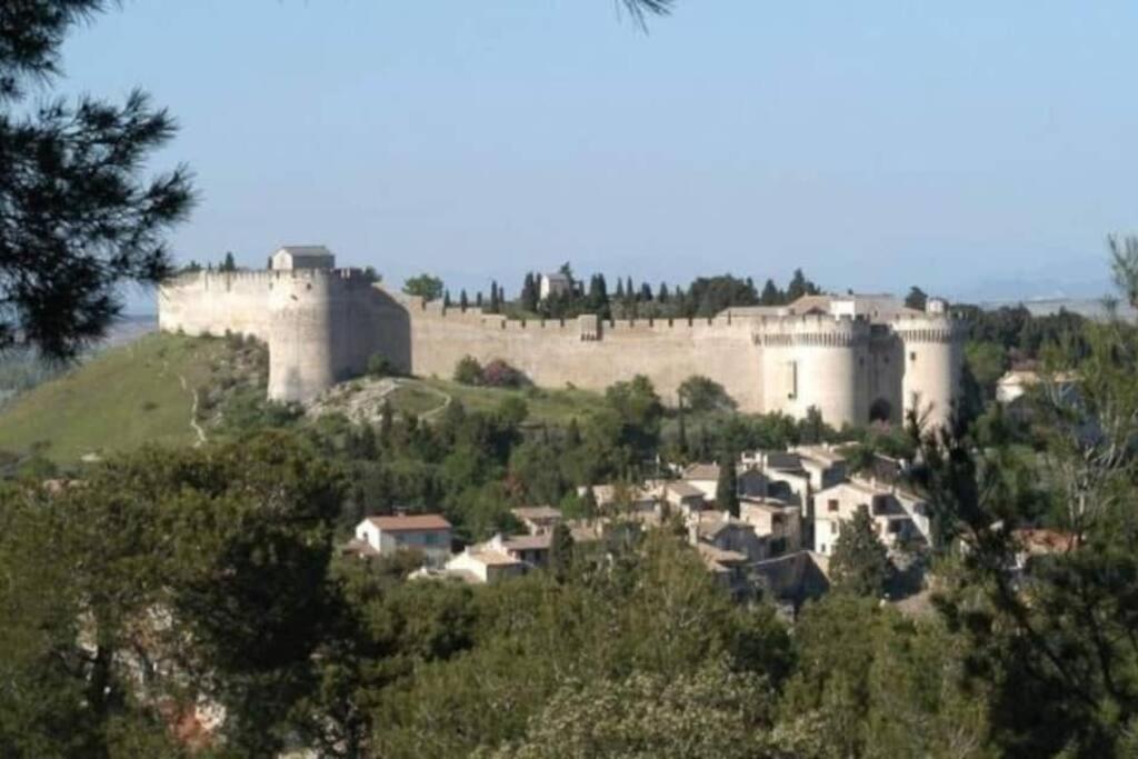 a group of castles on top of a hill at La Cigale - Vieux Village - Charmante Maisonnette climatisée avec Jardin in Villeneuve-lès-Avignon