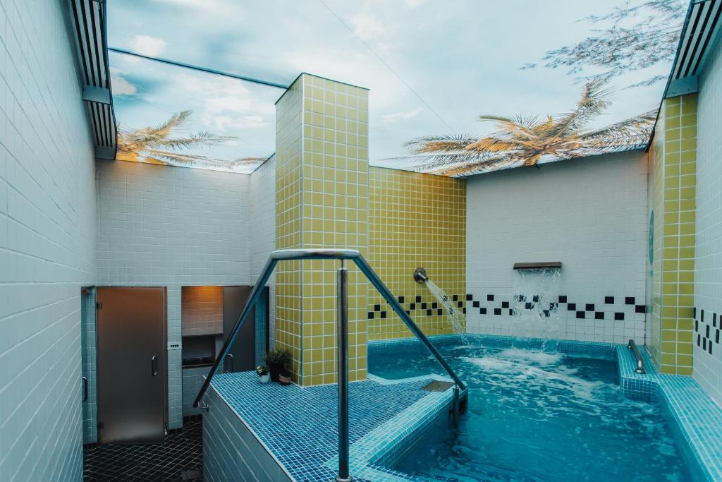 a bathroom with a hot tub in a building at Gran Hotel Don Manuel in Cáceres