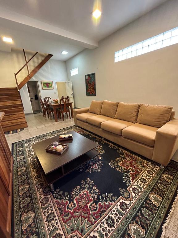 a living room with a couch and a table at Departamento Completo, 3 habitaciones. Excelente ubicación in Asunción