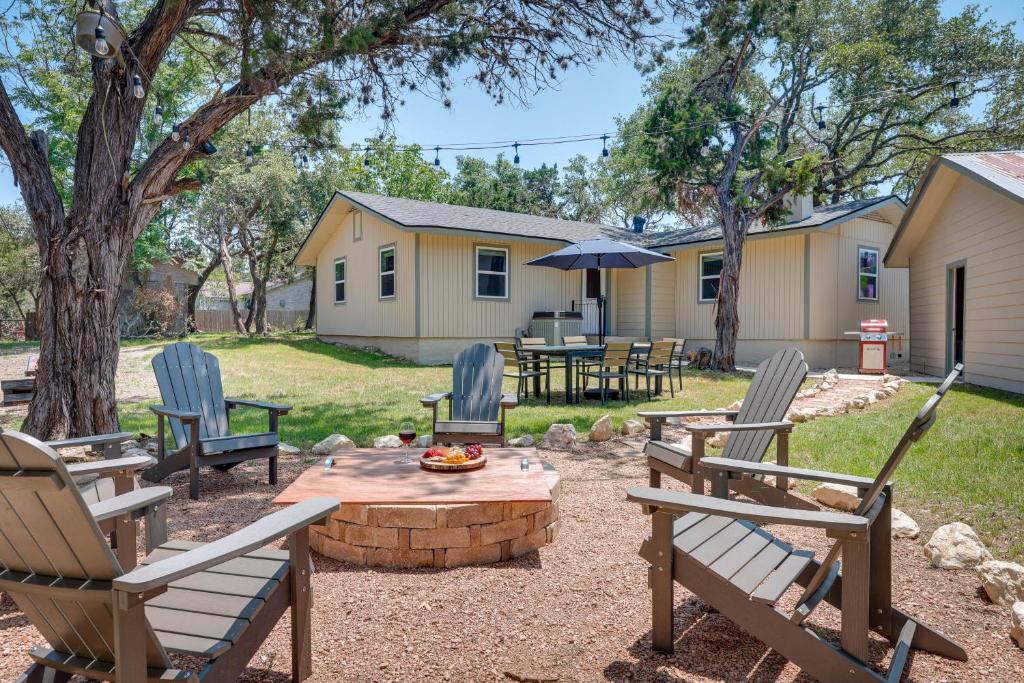 a patio with chairs and a table with an umbrella at Canyon Lake Vacation Rental Less Than half Mi to Water! in Canyon Lake