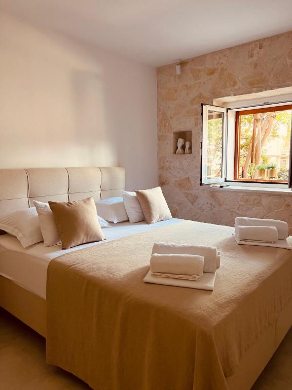 Postel nebo postele na pokoji v ubytování Oleander Apartment & Room Centar