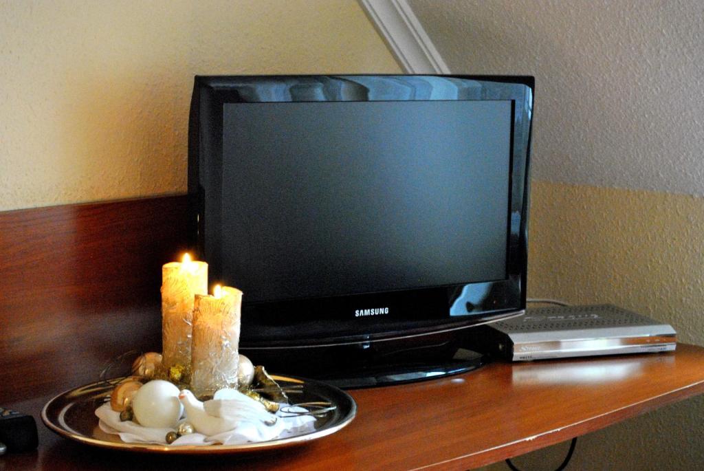 TV a/nebo společenská místnost v ubytování Barokk Antik Guest House