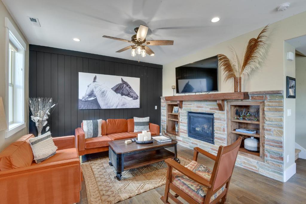 a living room with a couch and a fireplace at Park City Vacation Rental with Private Hot Tub! in Keetley Junction