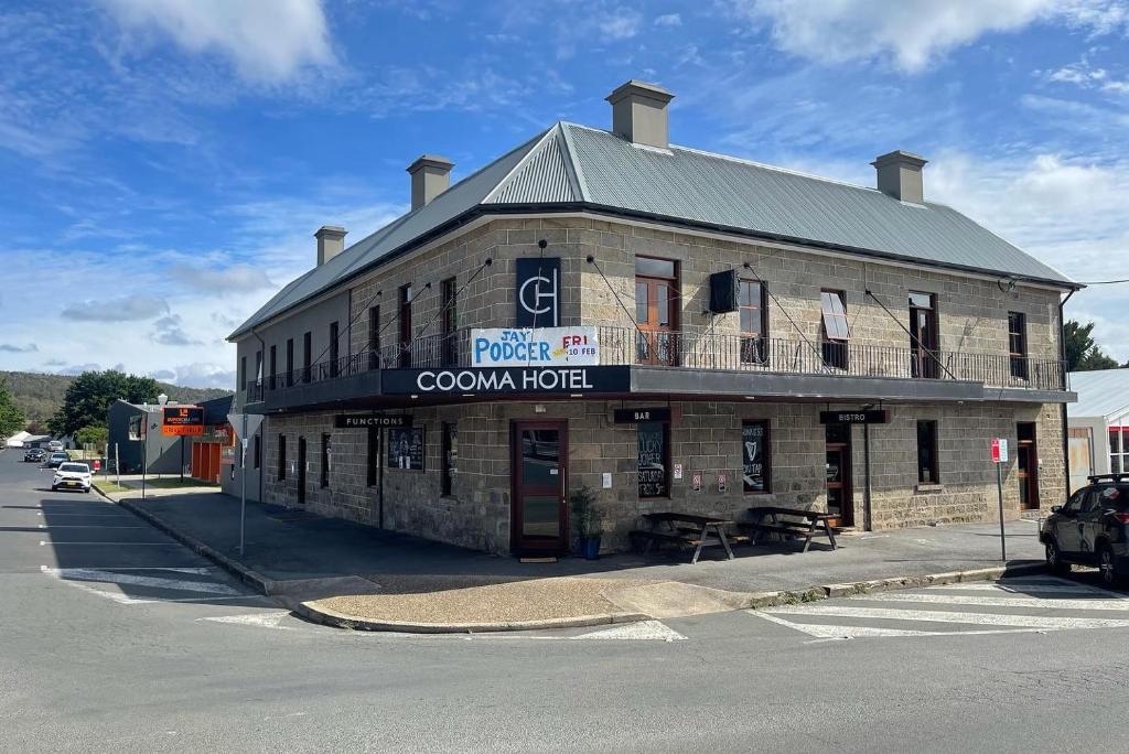 a building on the corner of a street at Cooma Hotel in Cooma