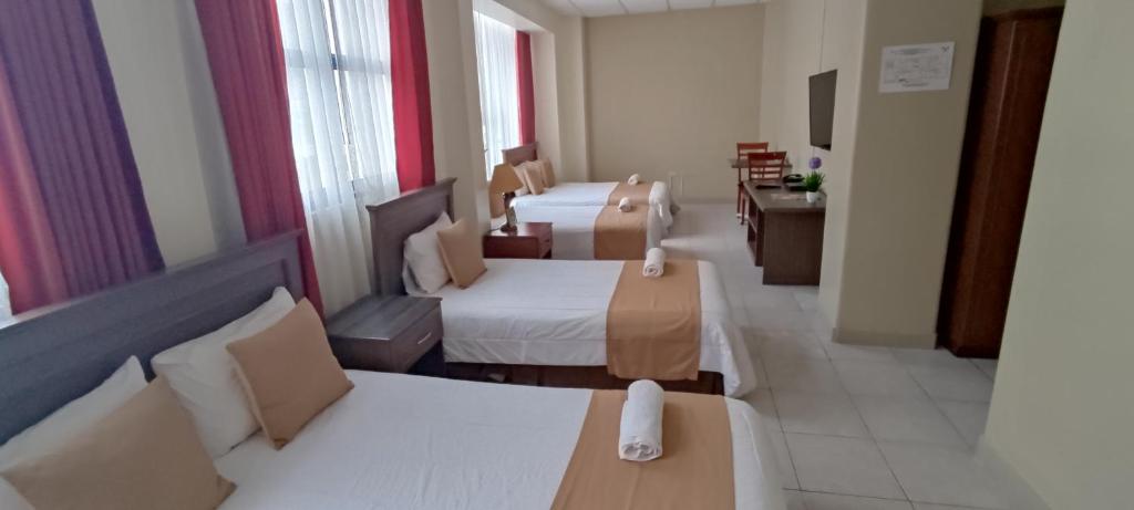 Postel nebo postele na pokoji v ubytování Hotel Las Peñas