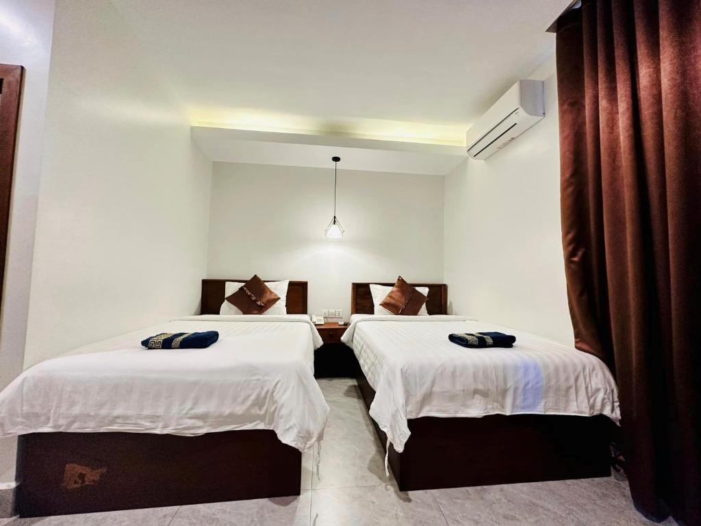 Postel nebo postele na pokoji v ubytování Laluna Guesthouse