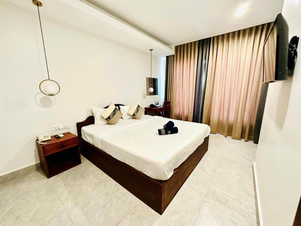 Postel nebo postele na pokoji v ubytování Laluna Guesthouse