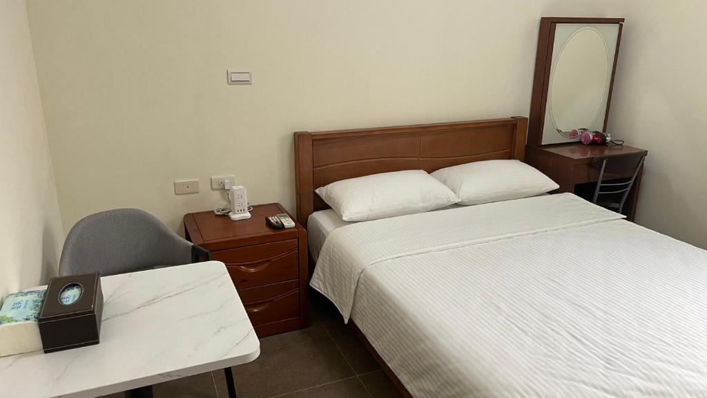 Postel nebo postele na pokoji v ubytování Sharkat Homestay