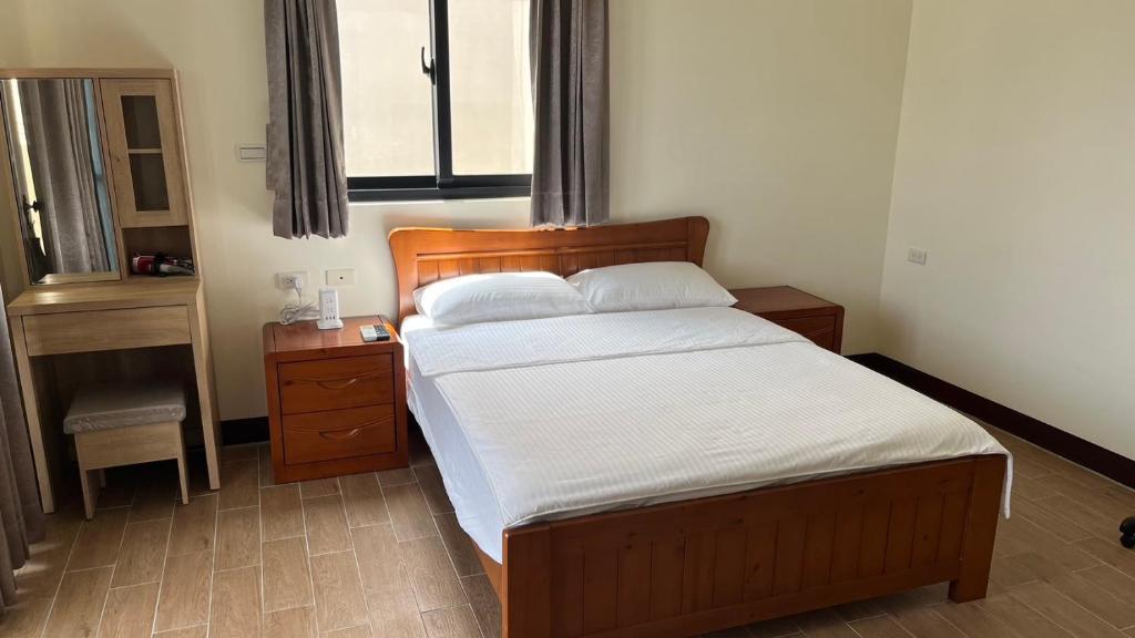 Postel nebo postele na pokoji v ubytování Sharkat Homestay