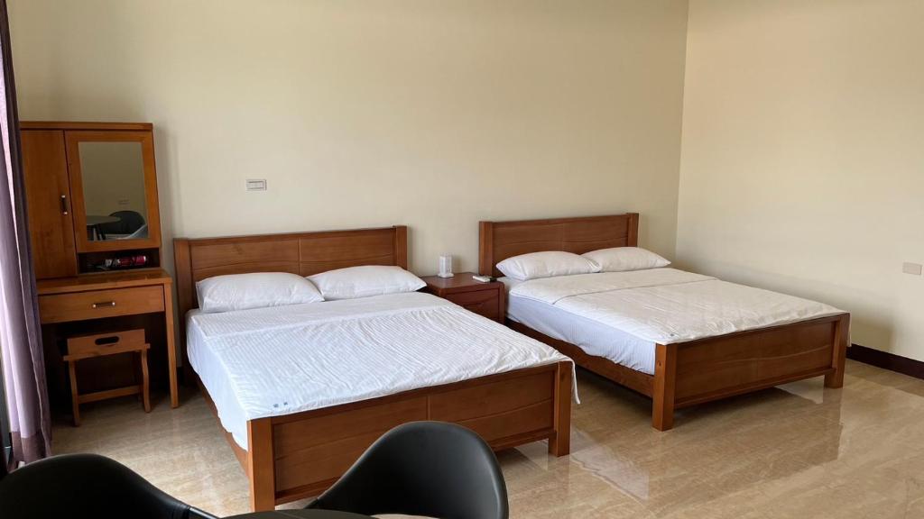 Postel nebo postele na pokoji v ubytování Sharkat Homestay