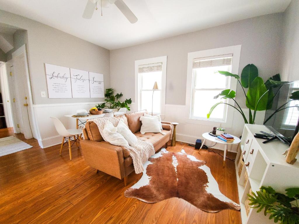 a living room with a couch and a table at Luxe 3BR Apartment at MIT Harvard with FREE parking in Cambridge