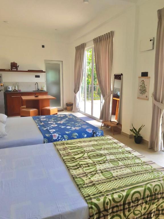 Postel nebo postele na pokoji v ubytování Pearl's Homestay Matale