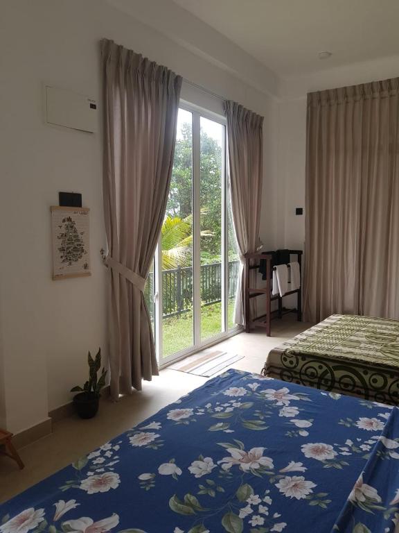 Postel nebo postele na pokoji v ubytování Pearl's Homestay Matale
