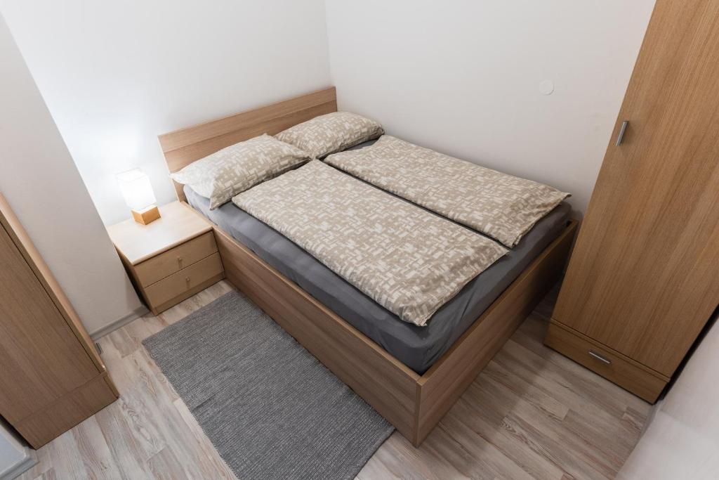 Postel nebo postele na pokoji v ubytování Apartment Kanalec